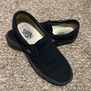 All black slip on vans